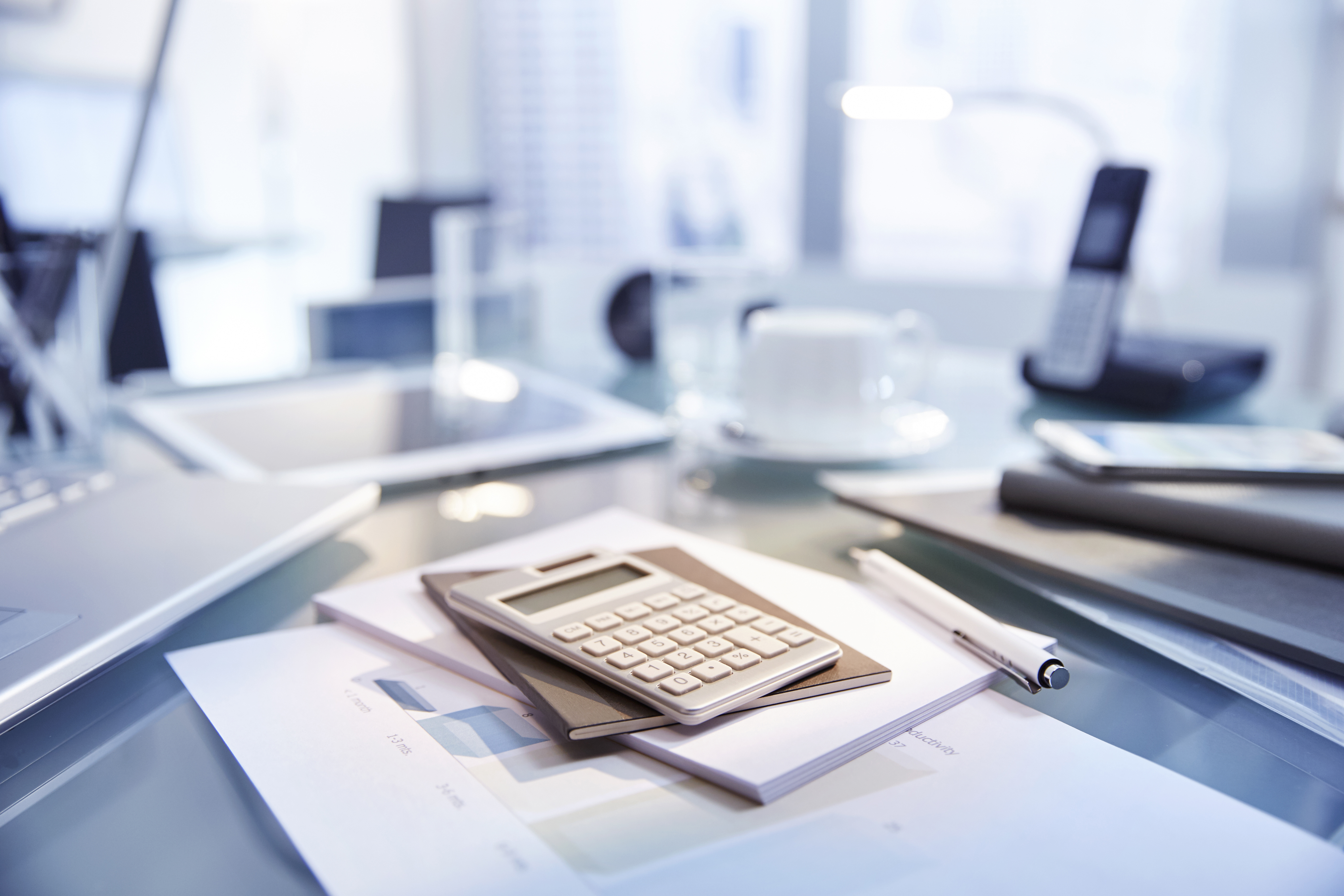 Business documents and a calculator